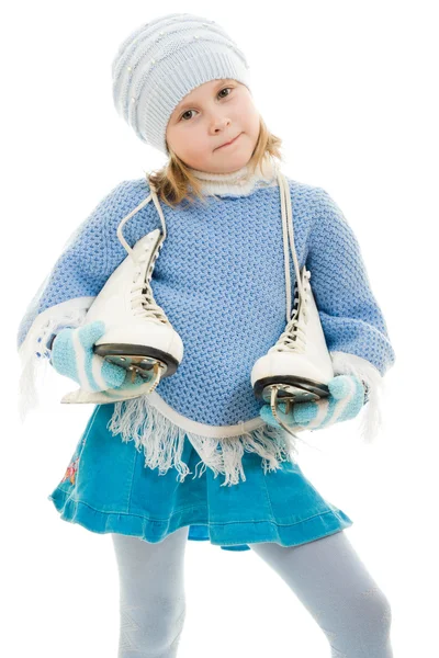 Девушка с коньками на белом фоне . — стоковое фото
