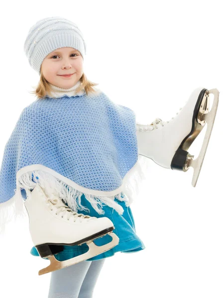 En flicka med skridskor på vit bakgrund. — Stockfoto