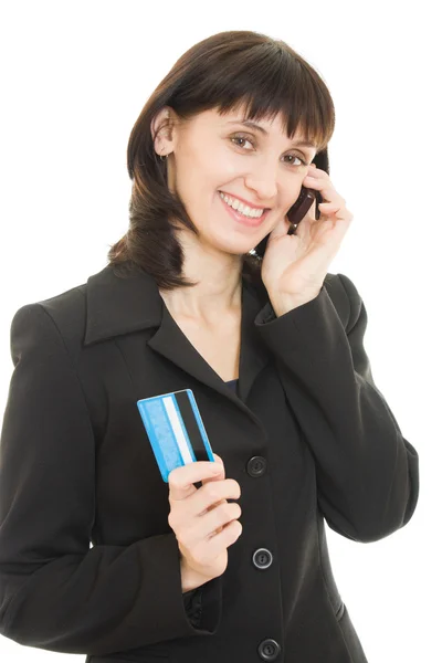 Ділова жінка платить з кредитною карткою по мобільному телефону, на білому тлі . — стокове фото