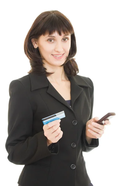 Iş kadını tarafından cep telefonu, beyaz arka plan üzerinde kredi kartı ile ödeme. — Stok fotoğraf