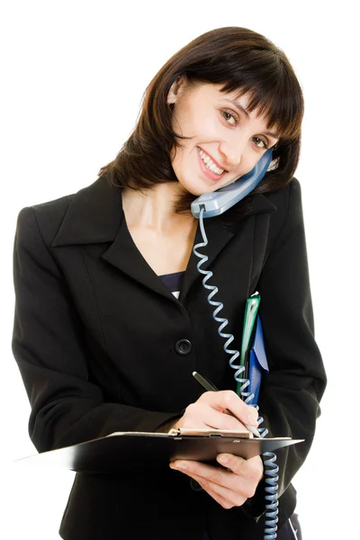 Vrouwelijke uitvoerend het neerschrijven van notities tijdens het gesprek op de telefoon — Stockfoto