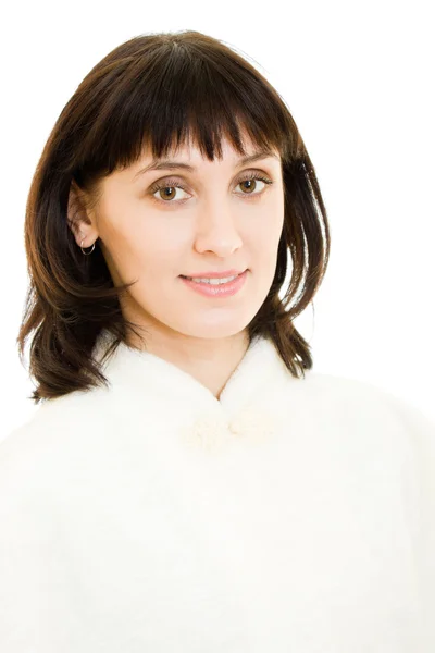 Aantrekkelijke glamoureuze vrouw in bontjas op een witte achtergrond. — Stockfoto