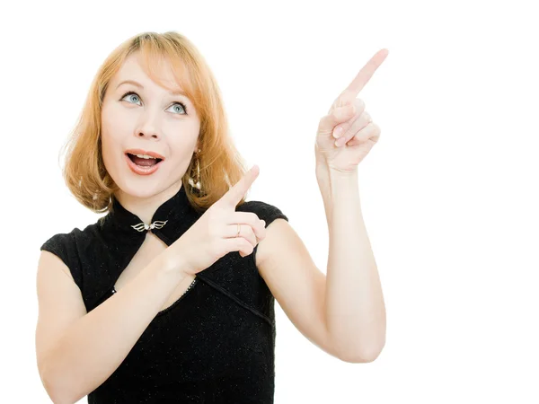 Mooie vrouw wijst een vinger omhoog op een witte achtergrond — Stockfoto