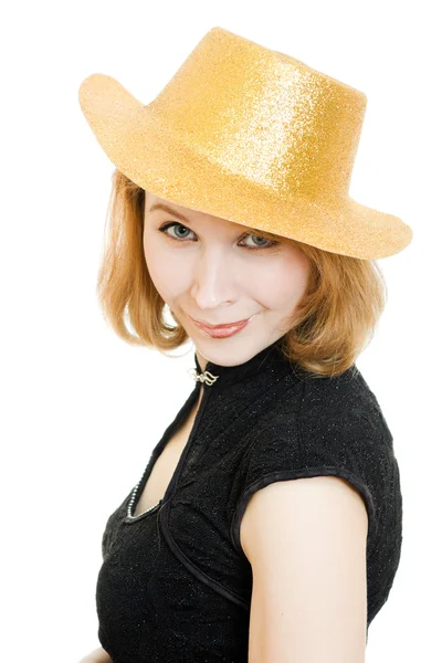 Beautiful woman in a gold hat on a white background. — Stock Photo, Image