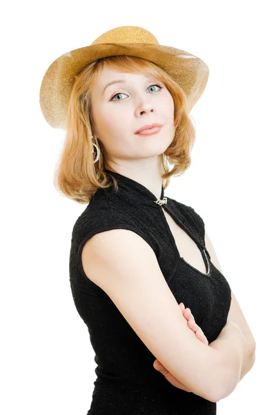 Mujer hermosa en un sombrero de oro sobre un fondo blanco . — Foto de Stock