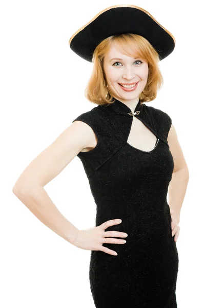 A beautiful woman in a black pirate hat on a white background. — Stock Photo, Image