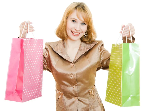 Mooie vrouw met boodschappentassen over Wit — Stockfoto