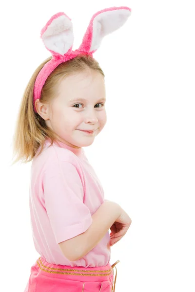 La niña con orejas rosadas conejito sobre fondo blanco . — Foto de Stock