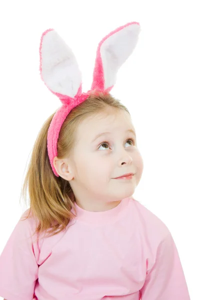Dziewczynka z różowymi uszami królik na białym tle. — Zdjęcie stockowe