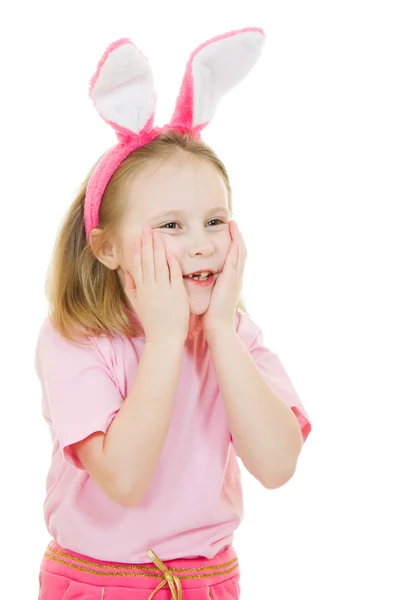 Holčička s růžové uši zajíčka na bílém pozadí. — Stock fotografie