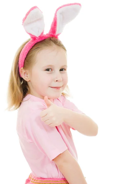 Το κοριτσάκι με ροζ αυτιά λαγουδάκι σε άσπρο φόντο. — Φωτογραφία Αρχείου