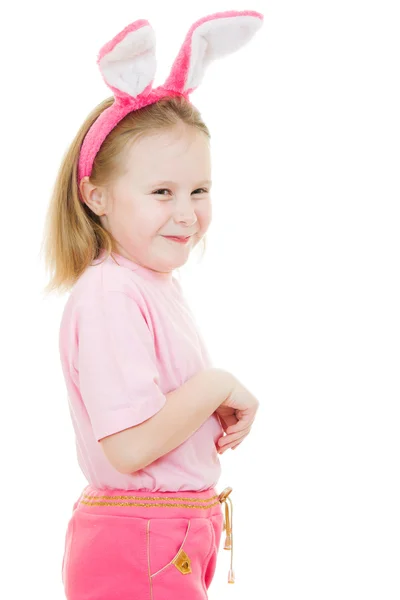 Das kleine Mädchen mit rosa Ohren Hase auf weißem Hintergrund. — Stockfoto