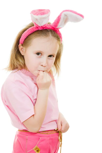 The little girl with pink ears bunny looks hurt on white background. — Stock Photo, Image