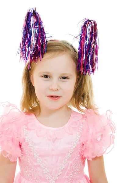 Funny girl in a pink dress with antennae on their heads on a white backgrou — Stock Photo, Image