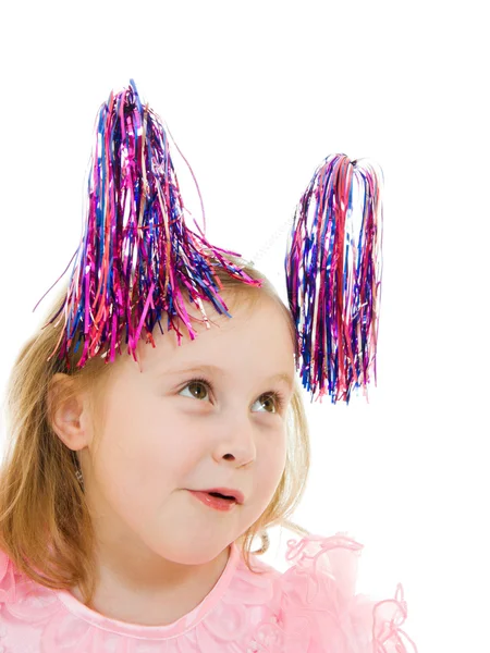 Zabawna dziewczyna w rózowej sukni z anteny na głowach na biały backgrou — Zdjęcie stockowe