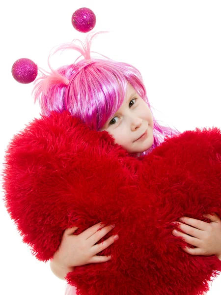 핑크 머리 소녀와 핑크 드레스는 좋음의 형태로 베개를 안 아 — 스톡 사진