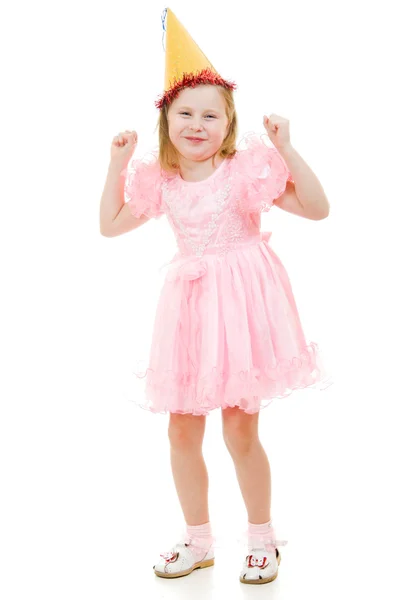 Ένα κορίτσι σε ένα ροζ φόρεμα και καπέλο χορούς σε λευκό φόντο. — Φωτογραφία Αρχείου