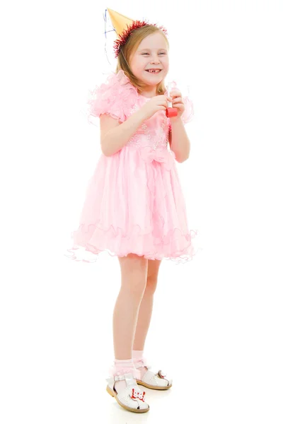 A girl in a pink dress and hat laughing on white background. — Stock Photo, Image