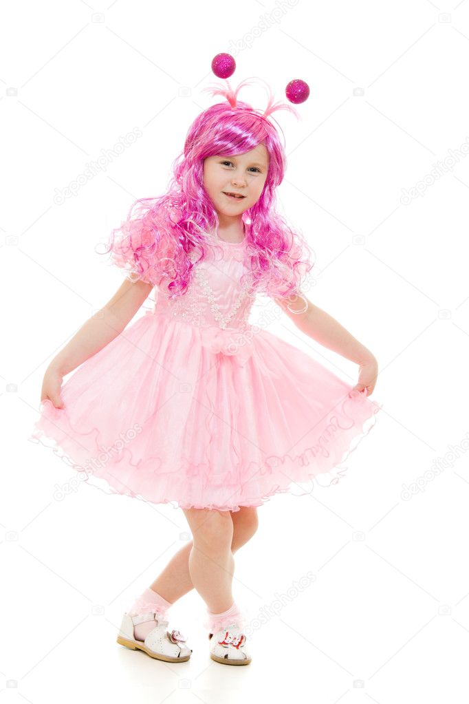 A girl with pink hair in a pink dress dancing on a white background.