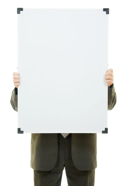 Podnikatel zakryl tvář s bílou tabuli na bílém pozadí. — Stock fotografie