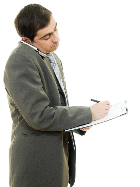Empresario escribiendo en la tableta sobre un fondo blanco . — Foto de Stock