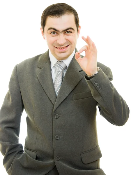 Μια χειρονομία επιτυχημένος επιχειρηματίας δείχνει εντάξει σε λευκό φόντο. — Φωτογραφία Αρχείου