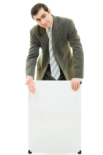 Um homem de negócios com um quadro branco sobre um fundo branco . — Fotografia de Stock