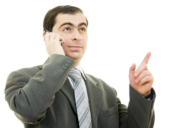 Бизнесмен разговаривает по телефону на белом фоне . — стоковое фото