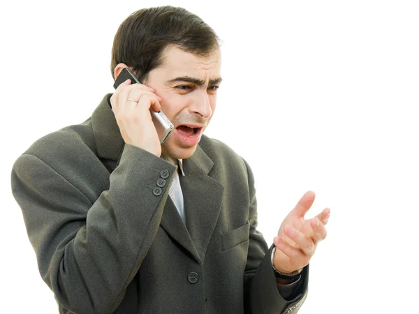 Empresario en peligro habla por teléfono sobre un fondo blanco — Foto de Stock