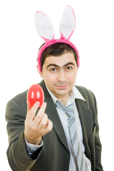 Podnikatel s králičíma ušima na bílém pozadí. — Stock fotografie