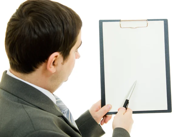 A businessman with a white blank sheet of paper on a white background. — Stock Photo, Image