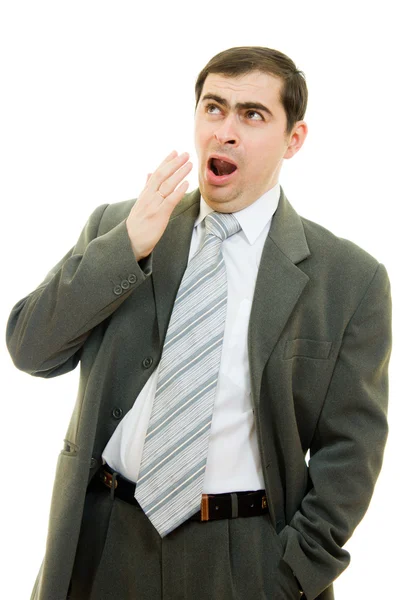 Uomo d'affari sbadigliando bocca che copre la mano su uno sfondo bianco . — Foto Stock