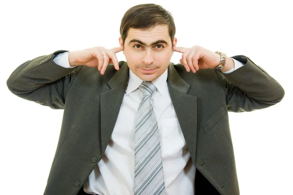 Uomo d'affari coperto le orecchie con le mani su uno sfondo bianco . — Foto Stock