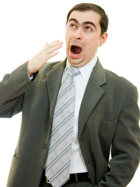 Podnikatel zející ústa pokrývající svou ruku na bílém pozadí. — Stockfoto