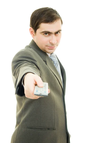 Uomo d'affari con telecomando su sfondo bianco . — Foto Stock
