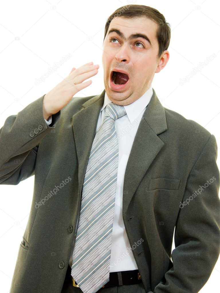 Businessman yawning mouth covering his hand on a white background.