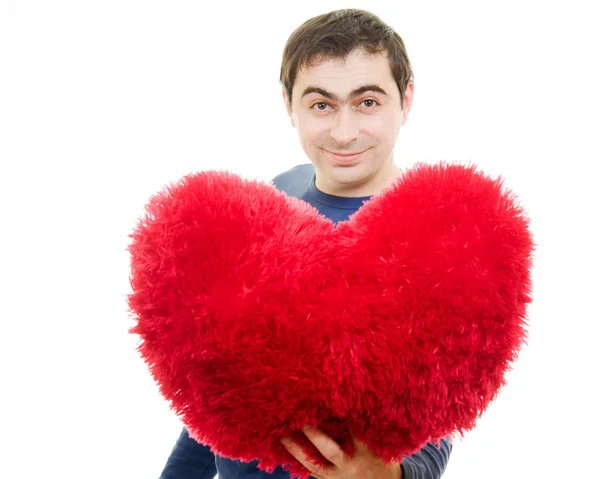 Ein Mann mit einem großen roten Herz auf weißem Hintergrund. — Stockfoto