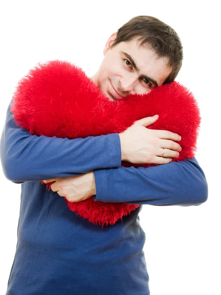 Een man met een grote rode hart op een witte achtergrond. — Stockfoto