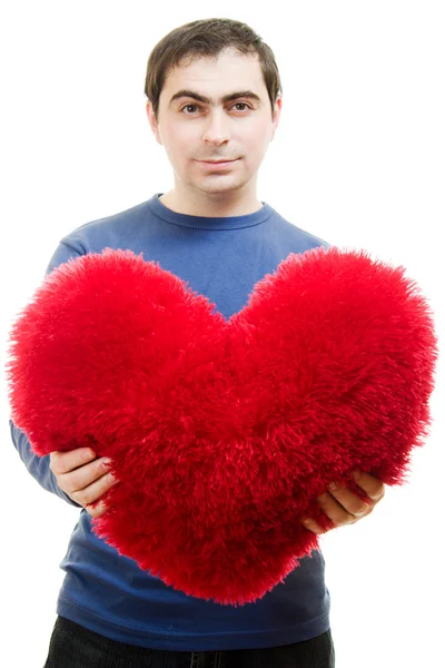 En man med ett stort rött hjärta på en vit bakgrund. — Stockfoto