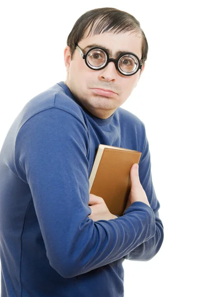 Estudiante en gafas con un libro sobre su cabeza sobre fondo blanco — Foto de Stock