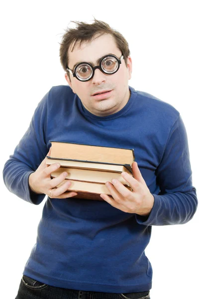 Studente in occhiali premuto con attenzione al petto un libro sul backgrou bianco — Foto Stock