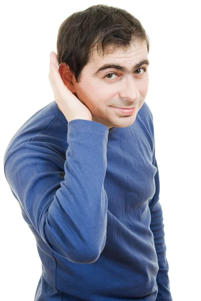 Porträt eines jungen Mannes, der Klatsch und Tratsch auf weißem Hintergrund hört. — Stockfoto