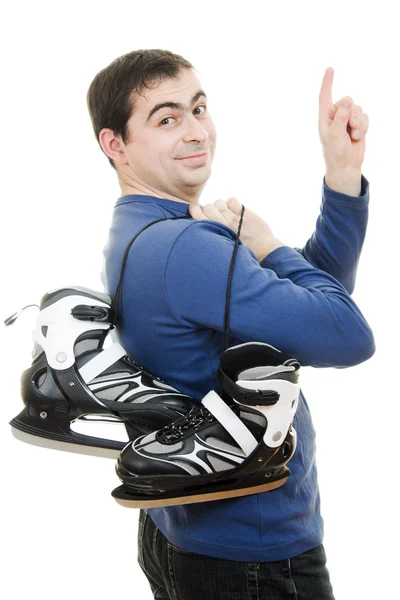 スケートを持つ男性白い背景の上の彼の指をポイントします。. — ストック写真