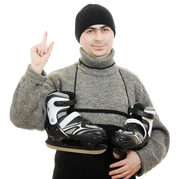 Mannen met schaatsen punten zijn vinger op witte achtergrond. — Stockfoto