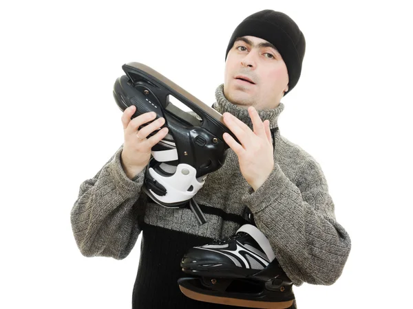Человек с коньками на белом фоне . — стоковое фото