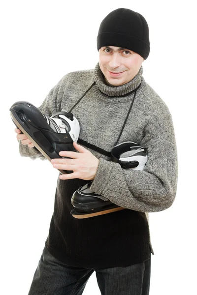 Man met schaatsen op witte achtergrond. — Stockfoto