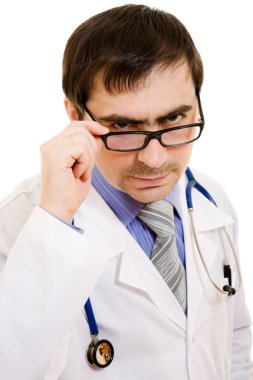 Serious doctor with a stethoscope and glasses on a white background.