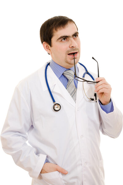 A doctor with a stethoscope and glasses thinking on a white background