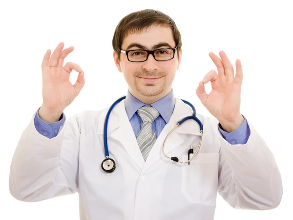 Un médecin avec un stéthoscope et des lunettes geste montre bien sur un dos blanc — Photo