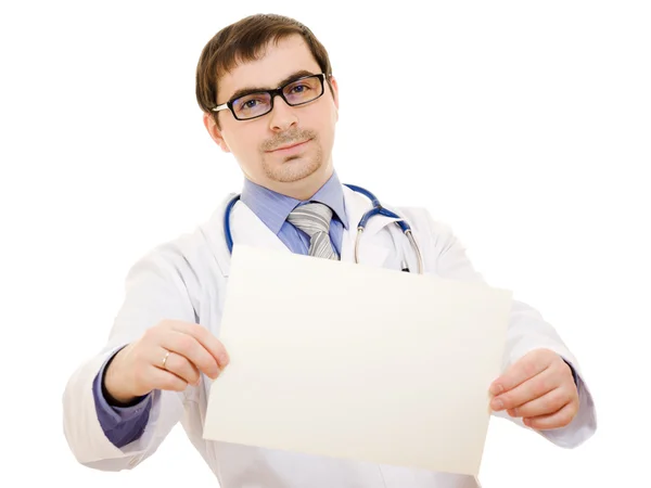 Male doctor with a blank sheet of paper on a white background. — Stock Photo, Image
